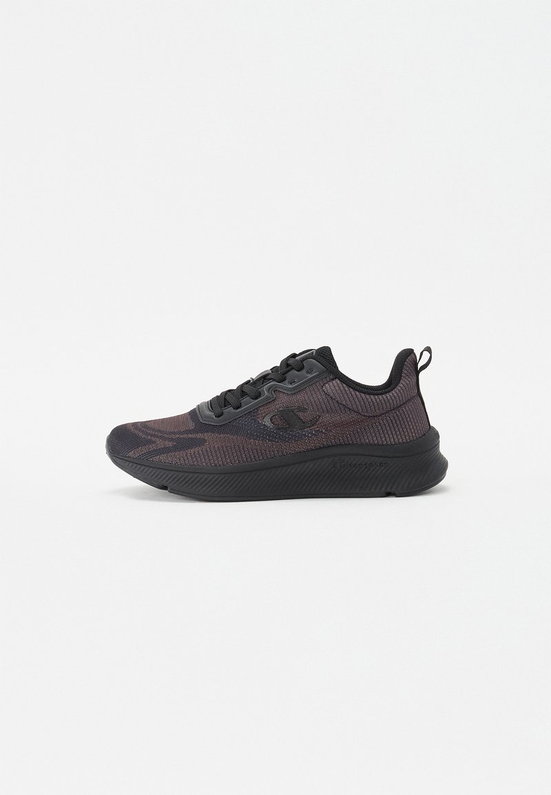 Black athletic shoe with textured mesh upper, cushioned sole, and subtle dark pattern. Features lace-up front and heel pull tab for easy wear.