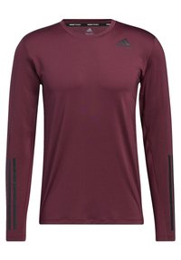 Czarna, długorękawowa koszulka sportowa w kolorze bordowym, wykonana z gładkiego, lekkiego materiału, z czarnym logo Adidas oraz trzema czarnymi paskami na każdym rękawie.