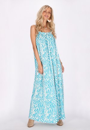 Maxime dress in a blue and white zebra pattern, jossa on ohut olkaimet, virtaava siluetti ja pehmeä, teksturoitu kangas.