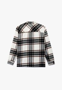 Flanellen shirt in crème, zwart, grijs en bruin ruitpatroon. Heeft lange mouwen, knoopmanchetten en een kraag met een rechte achterkant.