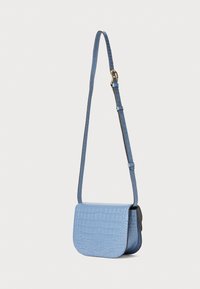 Crocodile-embossed blue leather crossbody bag with a flat flap closure and a slim, adjustable strap. Features gold hardware accents.
