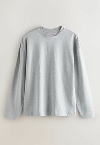 Light gray long-sleeve T-shirt in a soft material, featuring a crew neck and relaxed fit. No visible patterns or accents.