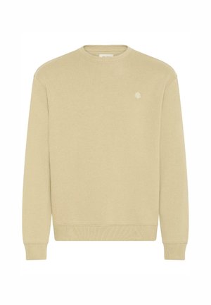 Sweatshirt beige à col ras du cou en tissu doux, avec des poignets et un ourlet côtelés, comportant un petit logo brodé sur la poitrine.