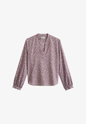 Blouse à manches longues avec imprimé floral rose et blanc, col rond avec fente frontale et poignets élastiqués.