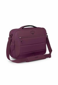 Borsa a tracolla Osprey viola con frontale imbottito, scomparti con zip, maniglia superiore e tracolla regolabile. La texture è liscia.