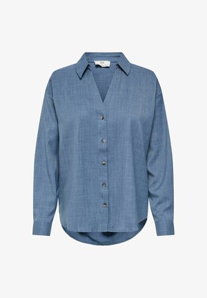 Blouse bleue à manches longues avec boutons, col et ourlet arrondi, fabriquée en tissu texturé léger.