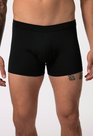 Zwarte boxershorts van rekbaar materiaal met een slim fit ontwerp, elastische tailleband en een gladde textuur. Geen zichtbare logo's of patronen.