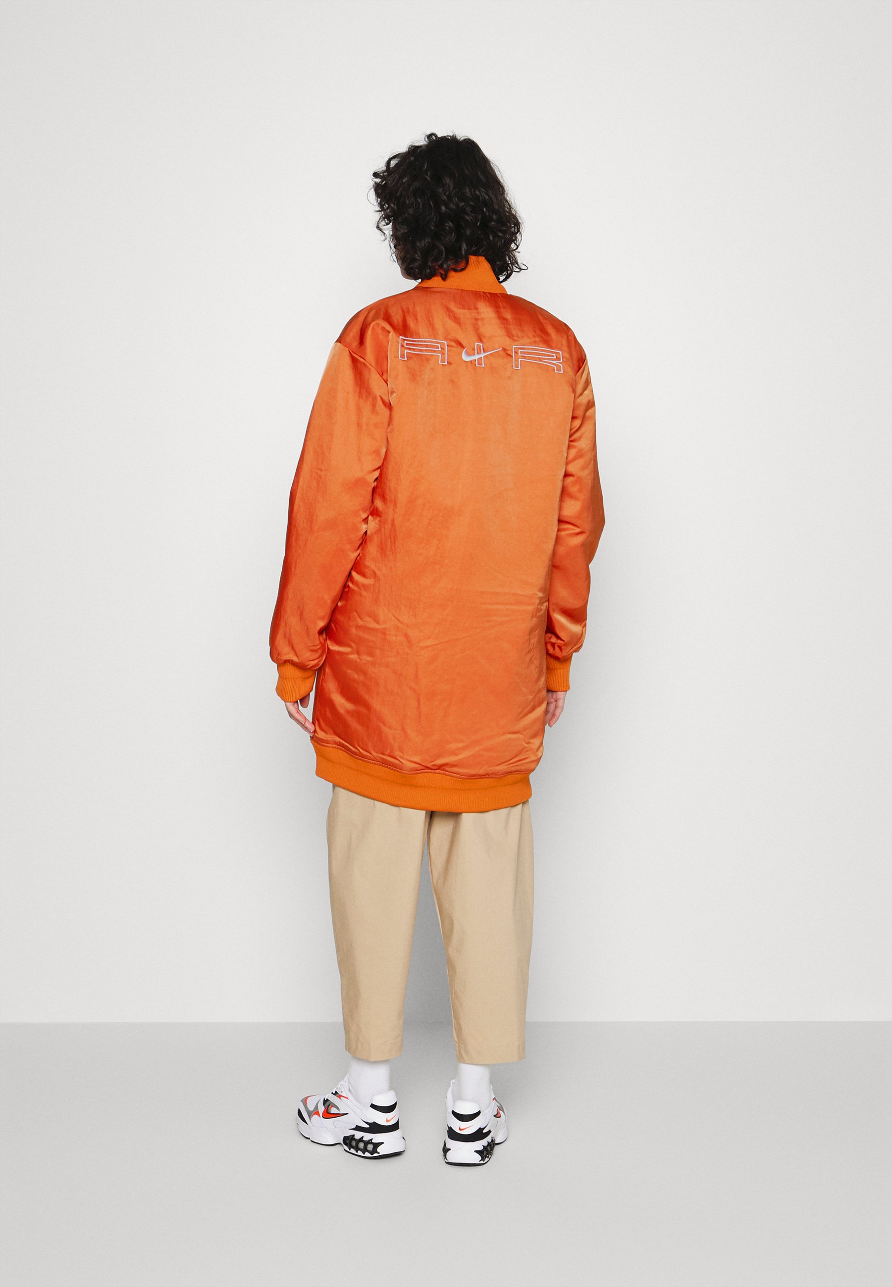 white and orange jacket