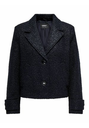 Giacca blu navy, con texture, colletto a revers, bottoni frontali e tasche laterali. Presenta maniche lunghe arrotolate e una fodera morbida.