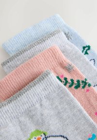 Four pairs of socks in soft cotton, featuring light blue, pink, and gray colors with ribbed textures and silver accents. Patterns include snowflakes and foliage.