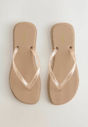 Barna papucs texturált talppal, átlátszó csillogó pántokkal és arany csillámpor díszítéssel a széleken. Egyszerű kialakítás, alkalmi viselethez ideális.