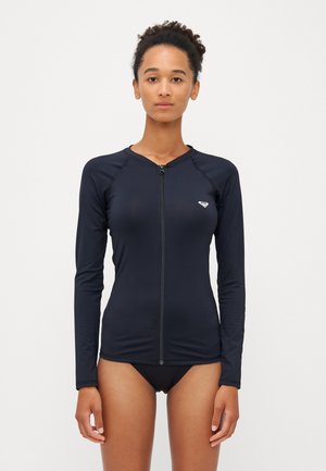 Black long-sleeve rash guard with a front zipper, made of stretchy material, featuring a logo on the left chest and smooth texture.