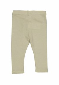 Leggings beige chiaro realizzati in un tessuto morbido e elasticizzato. Presentano una silhouette aderente, una vita elasticizzata e polsi orlati. Texture liscia.