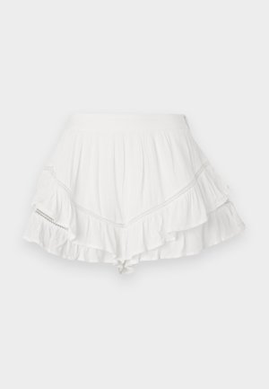 White skirt with layered ruffles, made of lightweight fabric. Features decorative stitching along the seams and a fitted waistband.