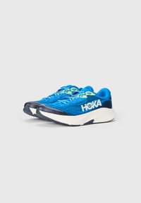 Blue athletic shoes with a mesh upper, tonal laces, and a white midsole. The logo is prominently displayed in white on the side.