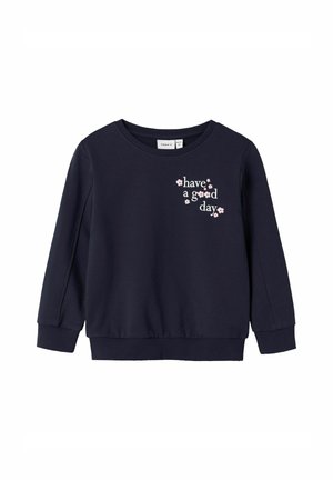 Navy blue sweatshirt with long sleeves and ribbed cuffs; features the text "have a good day" in pink with floral accents on the front.