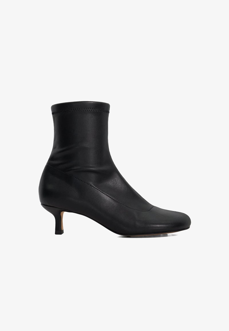 Black leather ankle boots with a fitted shaft, pointed toe, and low heel. Features a smooth texture and minimal stitching details.