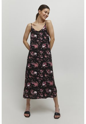 Schwarzes Blumenkleid mit dünnen Trägern, einem fließenden Design und bunten rosa und weißen Blumenmustern. Mid-Calf-Länge.