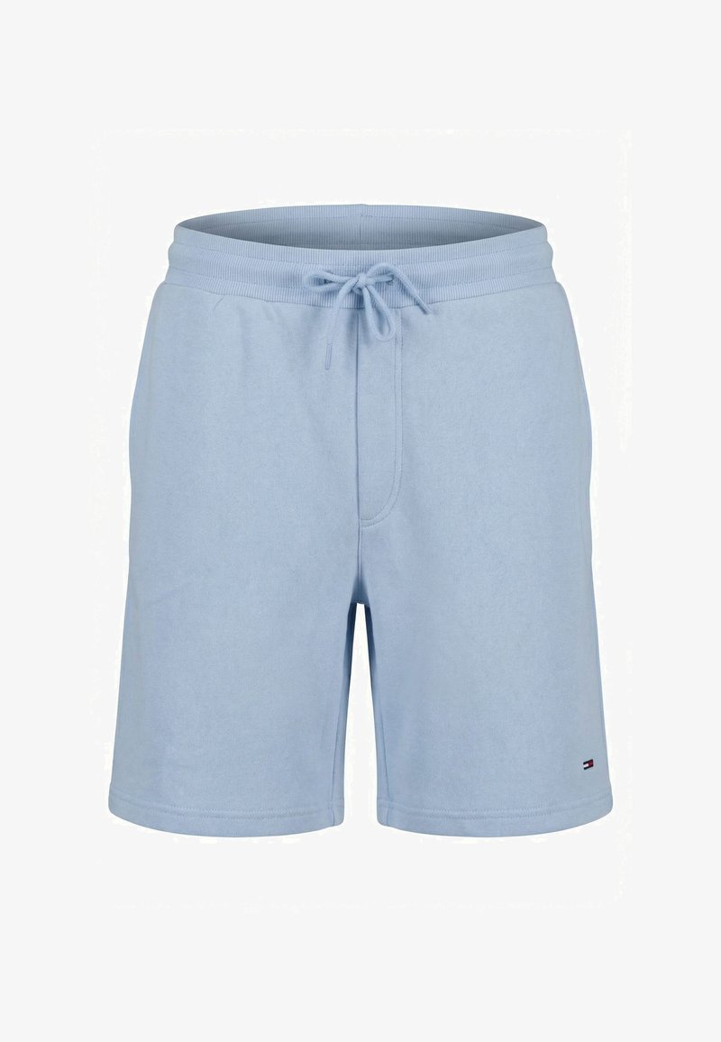 Short bleu clair longueur genou avec taille élastique et cordon, confectionné dans un tissu doux, avec un petit logo sur l'ourlet de la jambe gauche.
