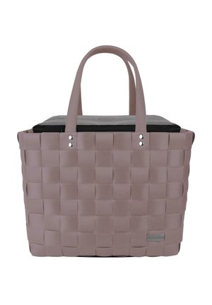 Woven tote bag in soft pink with two handles, featuring a black zippered lid and a smooth inner lining. Notable for its structured shape.