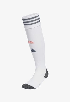 White knee-high sock with gray stripes at the top, gray heel and toe, featuring red and black logos on the side. Smooth knit texture.