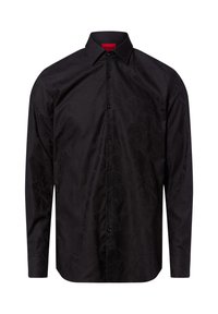 Zwart overhemd met een textuurafwerking, lange mouwen, puntige kraag en sluiting met knopen aan de voorkant. Bevat subtiele patroon details.