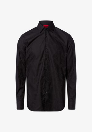 Zwart overhemd met een textuurafwerking, lange mouwen, puntige kraag en sluiting met knopen aan de voorkant. Bevat subtiele patroon details.