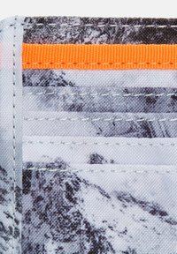 Canvas wallet featuring a black and white mountain print, an orange accent strip, and multiple card slots with gray stitching.
