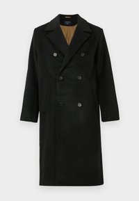 Sort dobbeltradet uldfrakke med hakket revers, store knapper og sidelommer; har en kontrastfyldet foring.