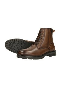 Bottines en cuir marron avec une finition texturée, bout rond et lacets sur le devant. Dotées d'une semelle en caoutchouc noir robuste avec un motif de semelle.