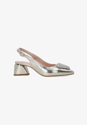 Silver slingback heel with a textured, snake-skin pattern, low block heel, and a decorative metallic embellishment on the toe.