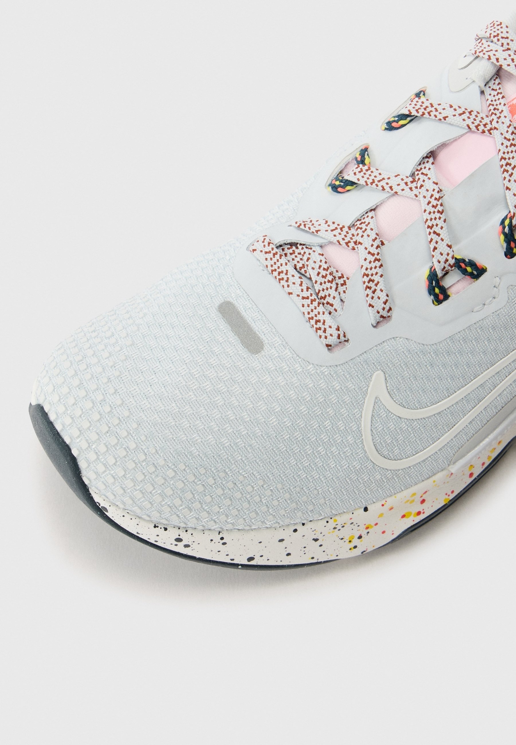 grey speckled nike shoes