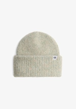Knit beanie in light green and cream, soft texture with ribbed design. Features a small white logo tag on the sides.