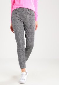 Gray textured trousers with a subtle pattern, featuring front pockets and a slim fit, paired with white sneakers and a pink sweater.