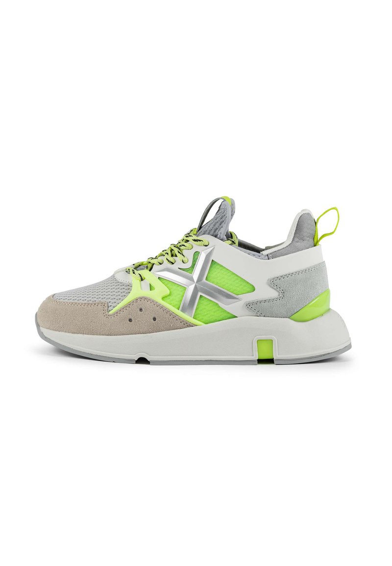 Lightweight sneaker featuring grey mesh and suede, bright green accents, silver detailing, and a chunky white sole. Laces are bright green.