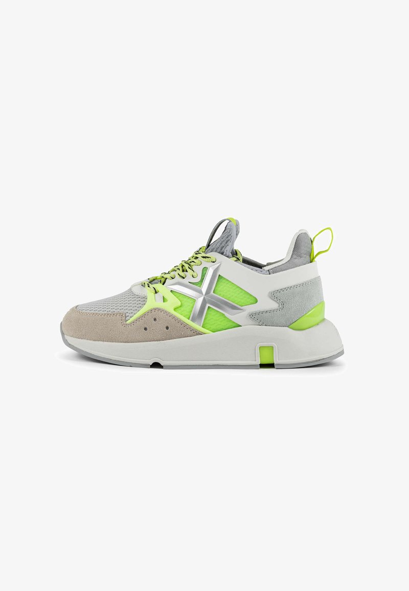 Lightweight sneaker featuring grey mesh and suede, bright green accents, silver detailing, and a chunky white sole. Laces are bright green.