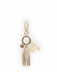 Portachiavi con una clip dorata, cerchio metallico, nappina in finta pelle beige, lettera "U" trasparente con accenti di glitter dorato e un piccolo cartellino di metallo.