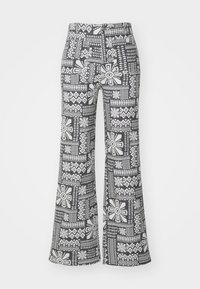 Black and white flared pants featuring a geometric floral pattern. Made from lightweight fabric with a smooth texture.