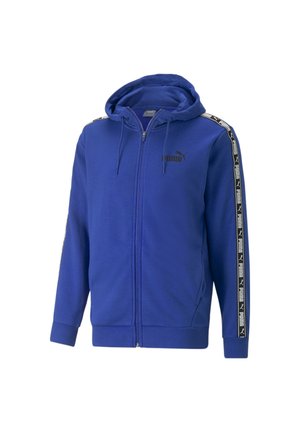 Felpa con cappuccio blu con cerniera, logo Puma nero sul petto e strisce nere e bianche con marchio che corrono lungo le maniche, con cappuccio regolabile con coulisse.