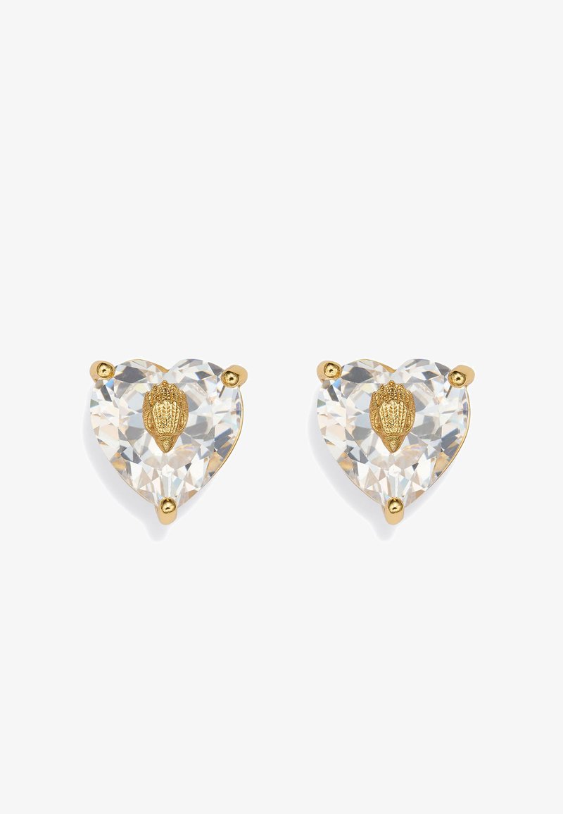 Para sercowo kształtnych przezroczystych kryształowych kolczyków na sztyfcie z centralnym złotym motywem muszelki, trzymanych przez trzy złote szpony każdy.