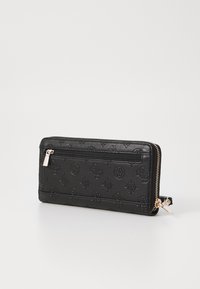 Portefeuille noir texturé en matériau synthétique, avec une fermeture à glissière autour et des motifs floraux gaufrés. Inclut une poche zippée à l'avant.