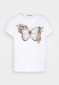White cotton t-shirt featuring a large brown and black butterfly graphic surrounded by pink flowers and green leaves. Short sleeves.