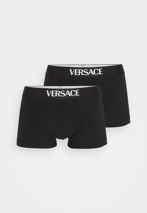 Black cotton boxer briefs with a white "VERSACE" logo on the waistband. Smooth texture and fitted design, sold in a pack of two.