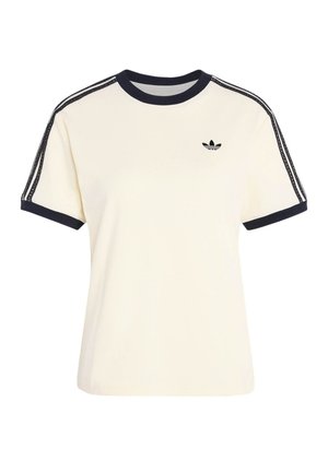 Flødefarvet kortærmet skjorte med sort kant ved krave og ærmekant, sorte dobbelstriber med syning på skuldrene og lille sort Adidas-logo på brystet.