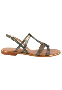 Platte sandalen met banden in metallic donkergrijs materiaal. Kenmerkt zich door een leren binnenzool, een verstelbare enkelband en een houten zool met gouden accenten.
