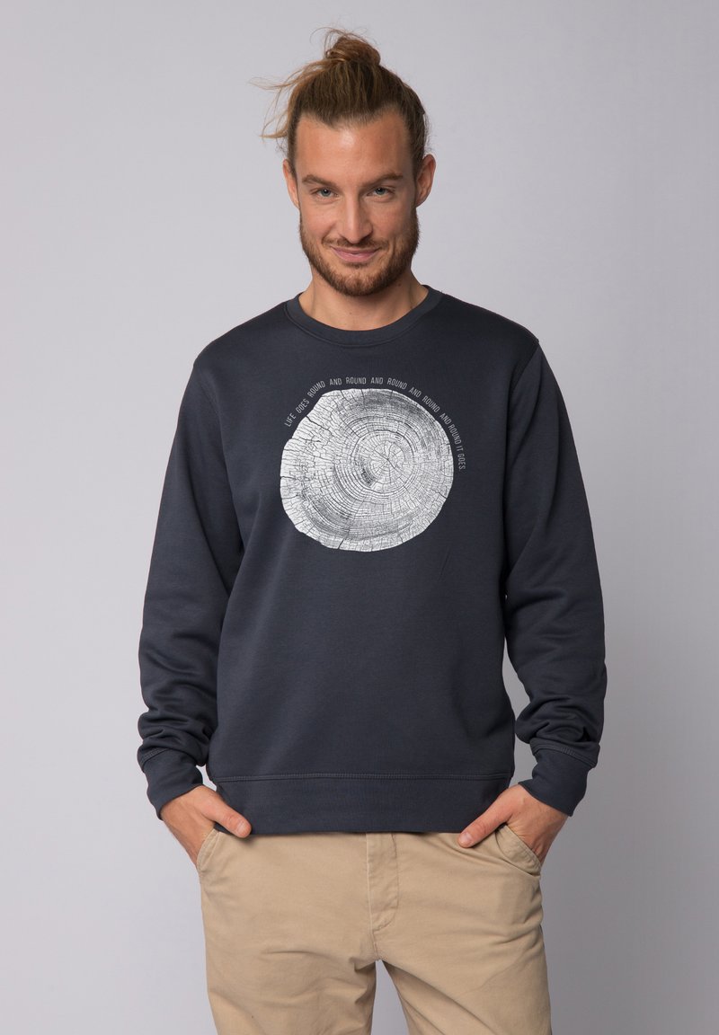Dunkelblaues Sweatshirt aus Baumwolle mit einem silbernen Baumring-Graphic und umgebendem Text. Gerippter Rundhalsausschnitt und Bündchen.