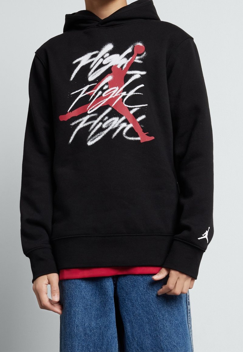 Hoodie nero realizzato in misto cotone, con una stampa grafica rossa e bianca di un giocatore di basket e il testo "Flight". Polsini rinforzati.