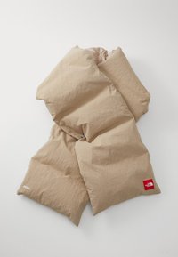 Beige puffer scarf with a compact design, featuring a smooth texture, stitched lines, and a contrasting red logo label.