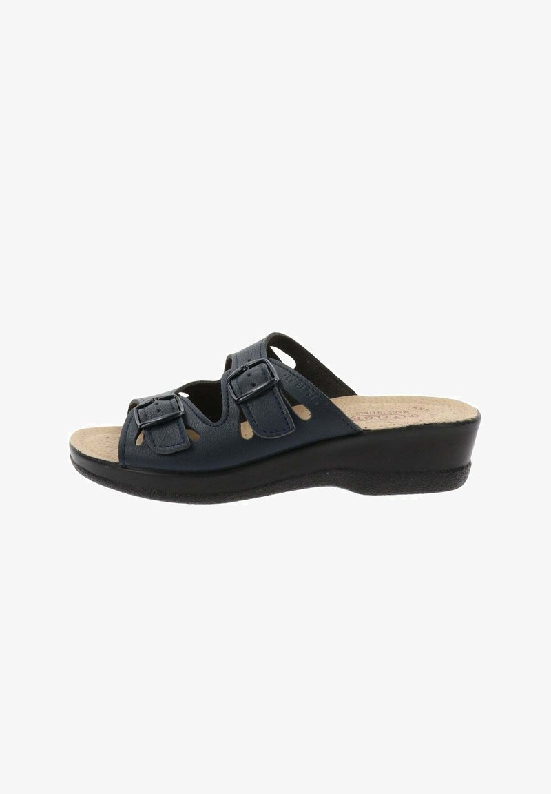Sandaña de cuero azul marino con dos hebillas ajustables, diseño abierto y una plantilla beige texturizada sobre una suela de cuña negra.