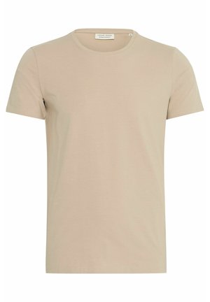 Beige pamut póló kerek nyakkivágással, rövid ujjakkal és egyenes fazonnal. Simasága és minimalista megjelenése miatt alkalmas hétköznapi viseletre.